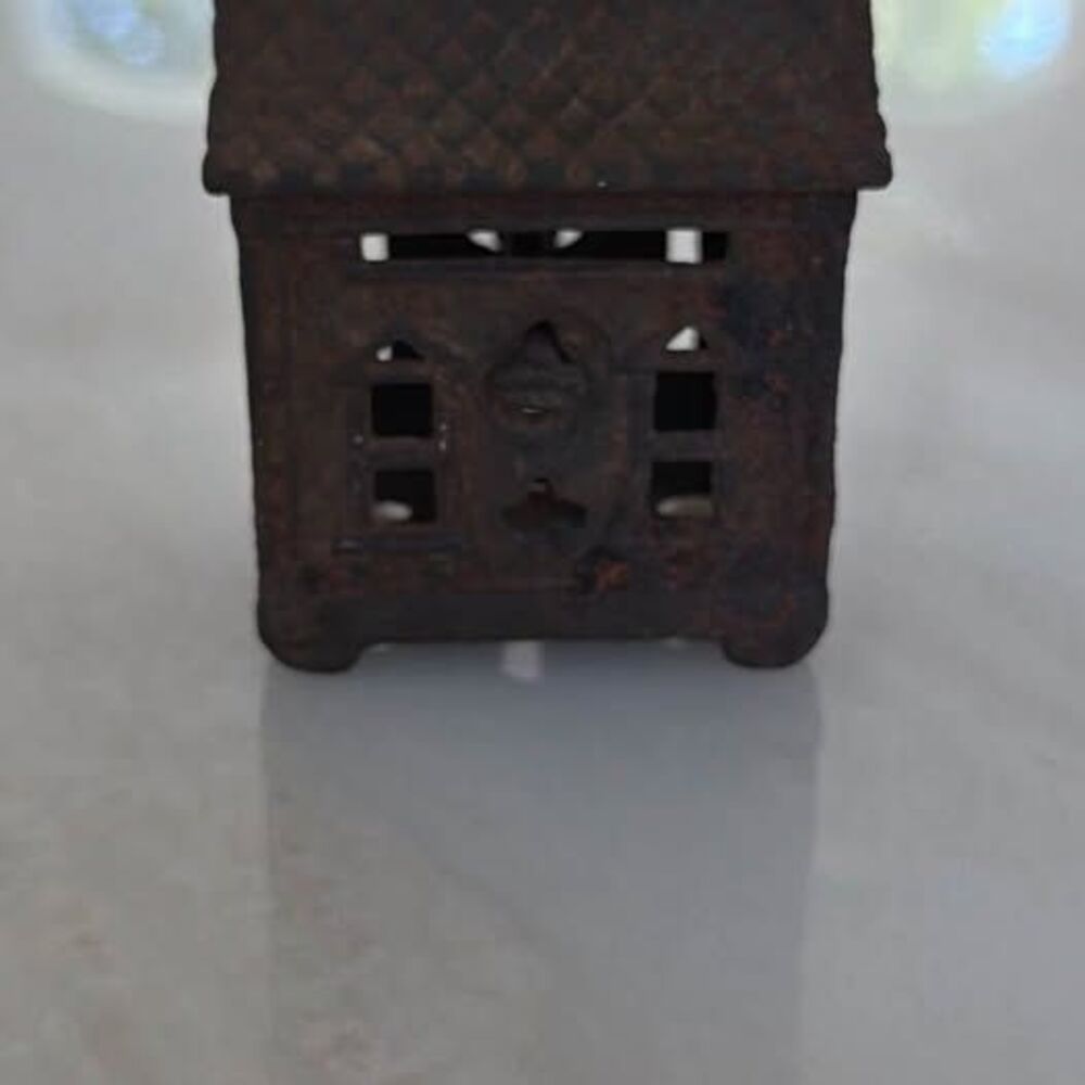 Antique cast iron penny house bank